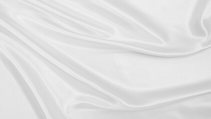 Smooth elegant white silk or satin luxury cloth texture as wedding background. Luxurious background design