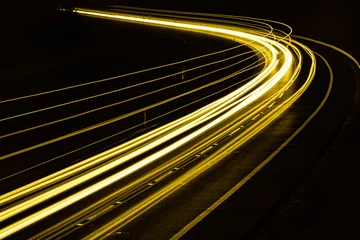 Cercles muraux Autoroute dans la nuit yellow car lights at night. long exposure