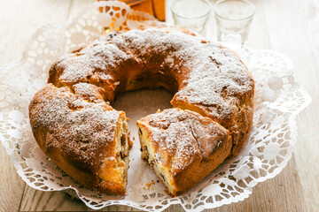 Sweet donut with nuts, apples and raisins