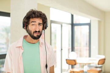 young crazy man listening music with headphones