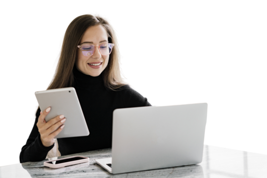SMM specialist in glasses smart cheerful woman uses a laptop and tablet workplace in the office employee of the company modern business clothes. Transparent isolated background.