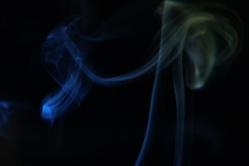 Fototapeta premium Yellow and blue smoke on a dark background, colourful abstract, one line, minimalistic art 