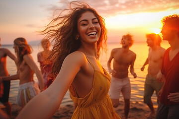 Happy friends partying on the beach. Blurred Happy friends sing and dance on the beach at a beautiful summer sunset. Young people celebrate summer. Summer holidays, lifestyle concept