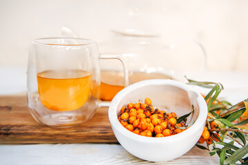 glass teapot filled with refreshing sea buckthorn tea