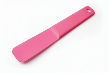 A minimalist vibrant pink spatula isolated on a white background 
