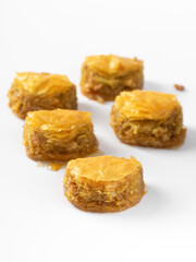 Pistachio baklava. Close-up baklava isolated on white background. Mediterranean cuisine delicacies
