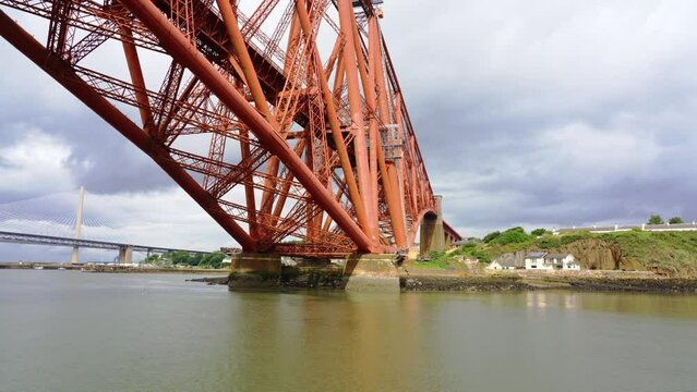 View from below of the old red metal bridge that crosses the Forth Canal in Edinburgh.