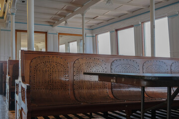 Classic historic interiors of old ferry boat ship liner with wooden paneling, brass glass windows...