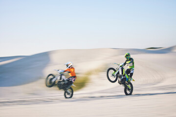 Speed, desert and people for cycling on a motorbike for travel, sports or freedom. Moving, fast and racers on bikes for adrenaline, challenge or driving on a sand course for adventure or competition