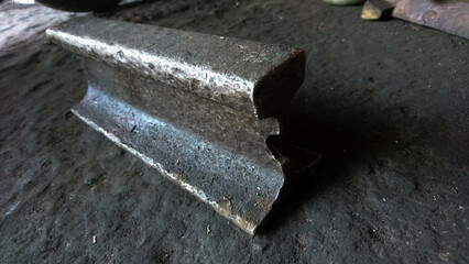 used cut rail on a dirty floor