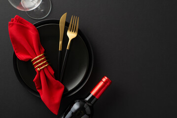 Black Friday luxury dining: Top view of impeccably arranged table, showcasing exquisite dinnerware, cutlery, red napkin with ring, wine bottle, glass on a black base. Ideal for your promotional needs - obrazy, fototapety, plakaty