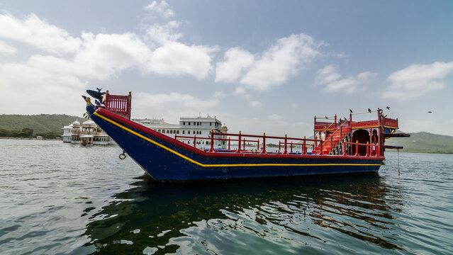 Udaipur, Rajasthan - Boat ride for tourist at The city palace Udaipur on the banks of Lake Pichola.