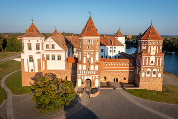 Fototapeta na wymiar Belorussian tourist ladmark attraction Mir Castle at sunny day, Belarus. Aerial view of a main gate of a medieval castle. Mir Castle Complex, a UNESCO World Heritage site in Belarus.
