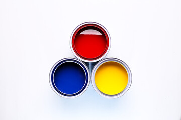colorful open paint cans red blue yellow isolated on white background
