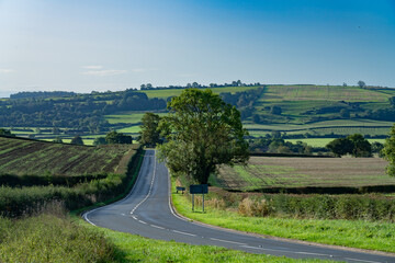 View across English farmland on sunny autumn day - 656466777