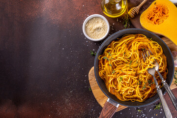 Homemade autumn pumpkin spaghetti pasta, vegan mediterranean, american vegan warming food with...