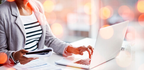 Laptop, bokeh and business woman typing with document for accounting budget research project. Technology, notebook and closeup of professional female accountant working on computer in workplace.