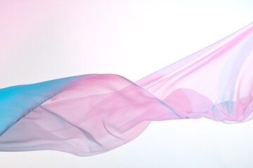 Closeup of rippled pink silk fabric, color fabric draped in soft waves empty bed sheet