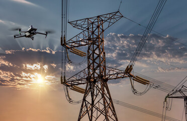 managing the electric grid, drone uav inspection technology on high voltage electricity pylon at sunset
