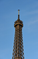 Tip of the Eiffel Tower on the blue sky