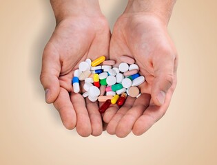 Woman hands with medical pills. Contraception reduces