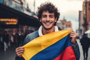 young 25 year old Colombian man with his flag on the street