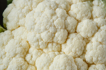 Fresh organic cauliflower on brown table. Organic cauliflower on rustic style background.