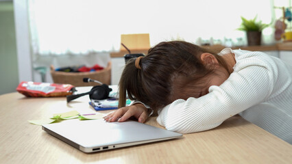 Tired asian young business woman sleepy using laptop working at home . bored Asia female teen...