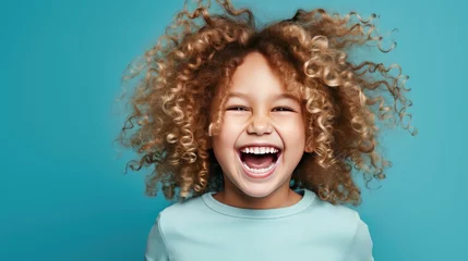 Fotobehang Happy little curly blond girl with big eyeglasses. Isolated on solid blue background - generative AI © Nad