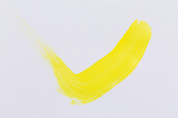 Yellow paint on white paper