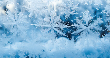 Abstract winter background with frosty patterns on a window