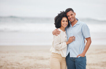 Couple, hug and portrait on beach, smile and love in marriage, getaway and holiday for bonding. Mexican people, happy and relax at ocean or sea, vacation and travel or trip, summer and peace by waves