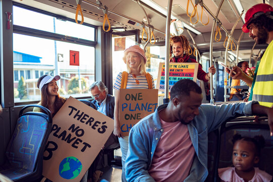 Diverse group of environmentalist going to a protest in the city on a bus
