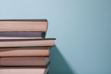 Stack of books on a light blue background