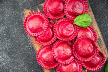 beet ravioli red color meat filling smoked ham Cooking appetizer meal food snack on the table copy space food background rustic top view