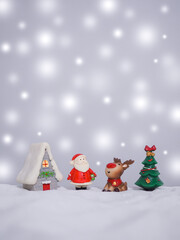 Raindeer and Santa claus in the town with shiny light for Christmas and New Year holidays background, Winter season, falling snow, Copy space for Christmas and New Year holidays greeting card.