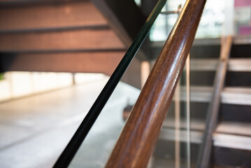 Stainless steel, glass and wood railing.Fall Protection. modern design of handrail and staircase.