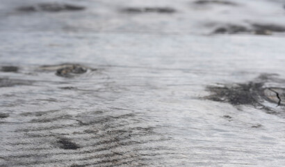 Grey, rustic wood as background with gradient of depth of field