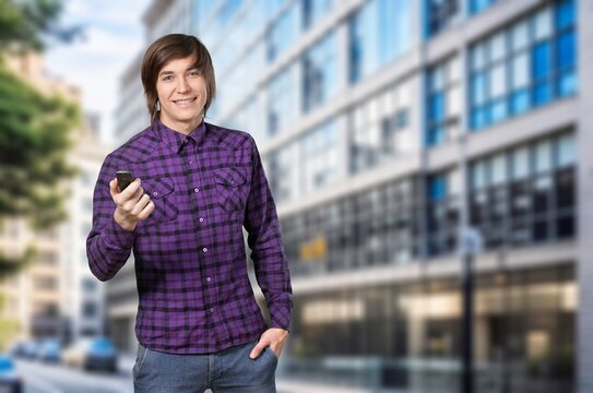 Young happy business man with phone on outdoor, AI generated image
