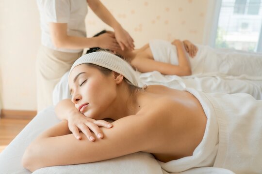 Spa massage, Two young beautiful women relaxing and enjoying at the spa, beautiful girl relaxing and enjoying at the spa.