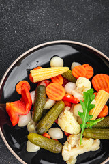 vegetables pickled salad spicy cucumber, gherkin, carrot, onion, cauliflower, pepper appetizer meal food snack on the table copy space food background rustic top view