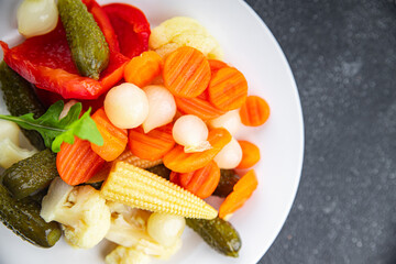 vegetables pickled salad spicy cucumber, gherkin, carrot, onion, cauliflower, pepper appetizer meal food snack on the table copy space food background rustic top view