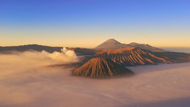 Sunrise at Mount Bromo, is an active volcano in Tengger Semeru National Park, East Java, Indonesia. Aerial drone view 4K.