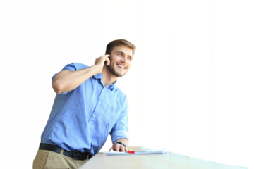 Smiling businessman standing and using mobile phone on a transparent background