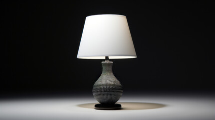 A white table lamp with a black shade
