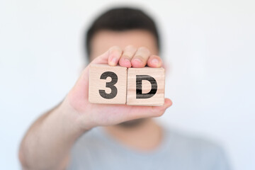 Man holding wooden cubes with 3D text on them, three dimensional or design idea, wooden block cubes...