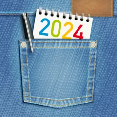 Fotobehang Concept de l’éducation scolaire et du cursus universitaire pour une carte de vœux 2024 avec une poche de blue-jeans et un bloc note comme symbole de la jeunesse. © pict rider