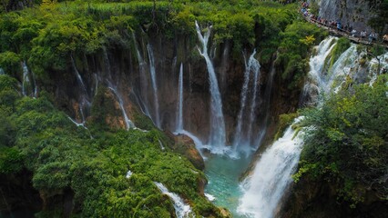 Plitvice Lakes National Park with many waterfalls. Clean water flows from cliffs in cascades....