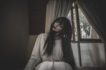 Portrait of asian woman make up ghost,Scary horror scene for background,Halloween festival...