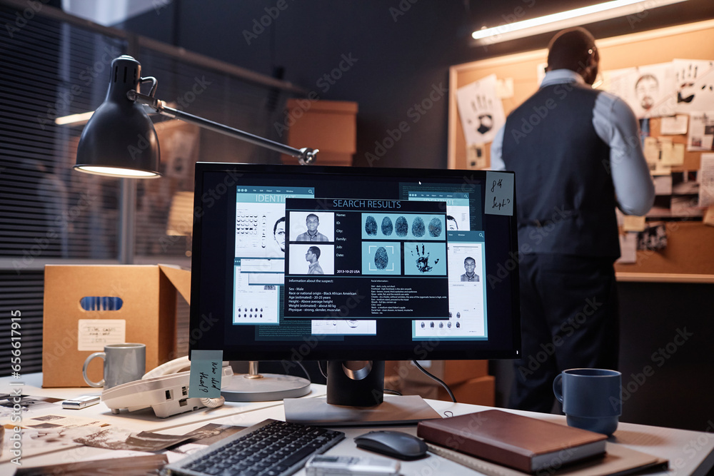 Wall mural background image of computer with case file on screen in detectives office, copy space